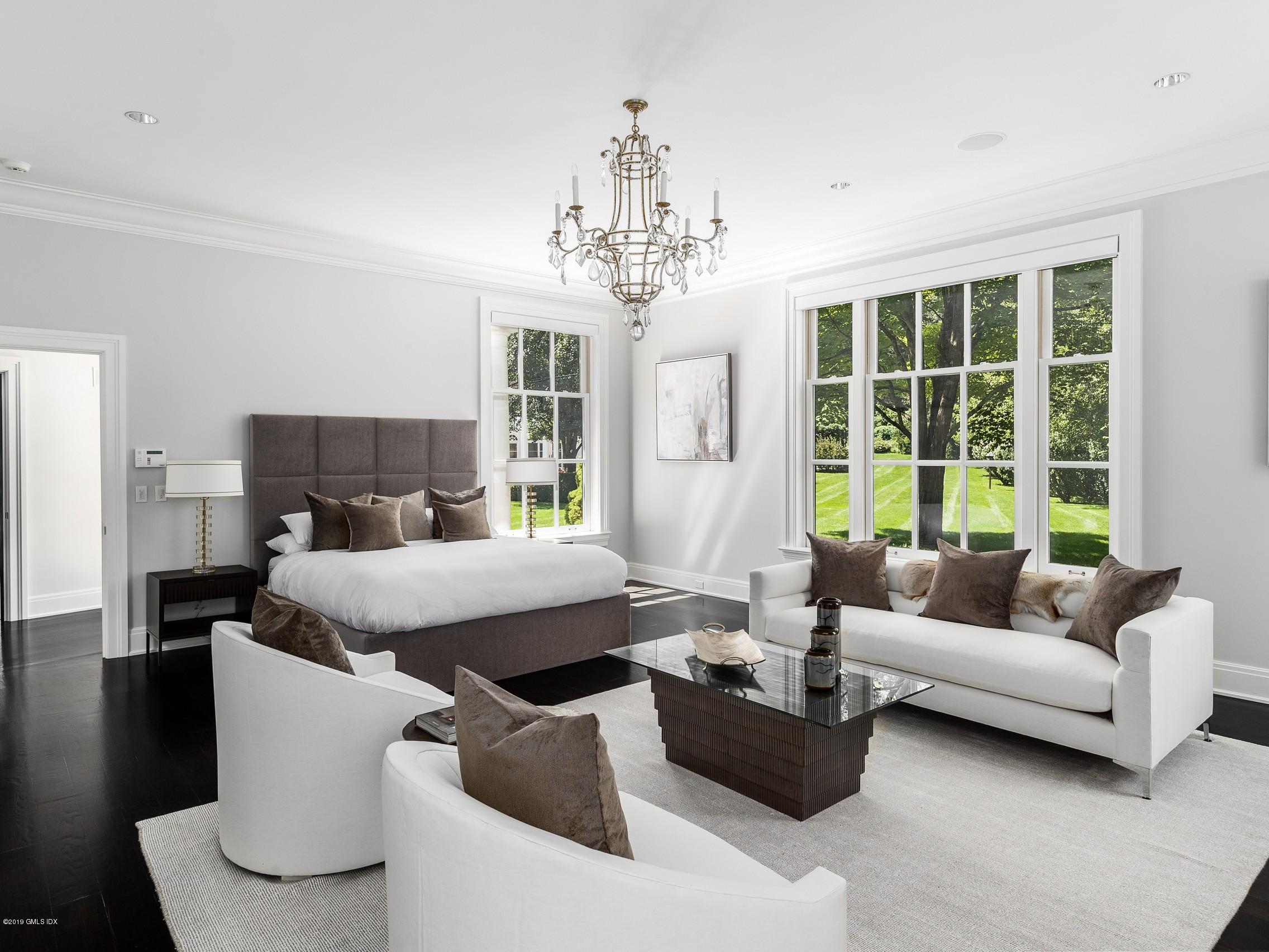 16 Andrews Farm Road Greenwich, CT 06831 - Photo 16 of 44 a living room with furniture and a chandelier
