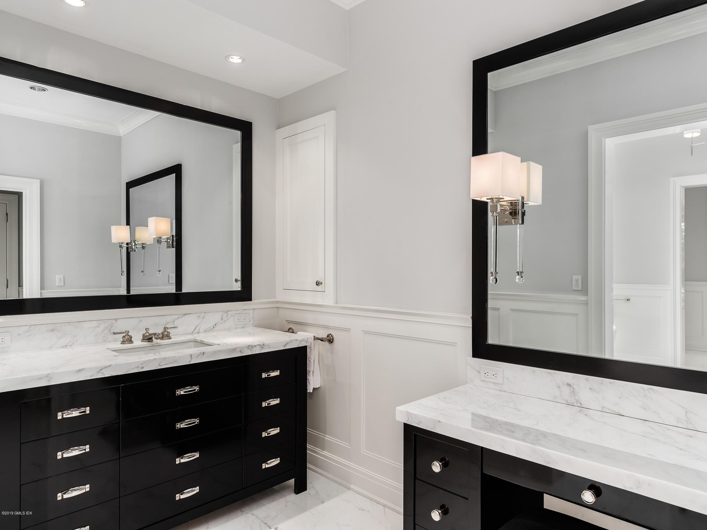 16 Andrews Farm Road Greenwich, CT 06831 - Photo 21 of 44 a bathroom with a sink vanity and mirror