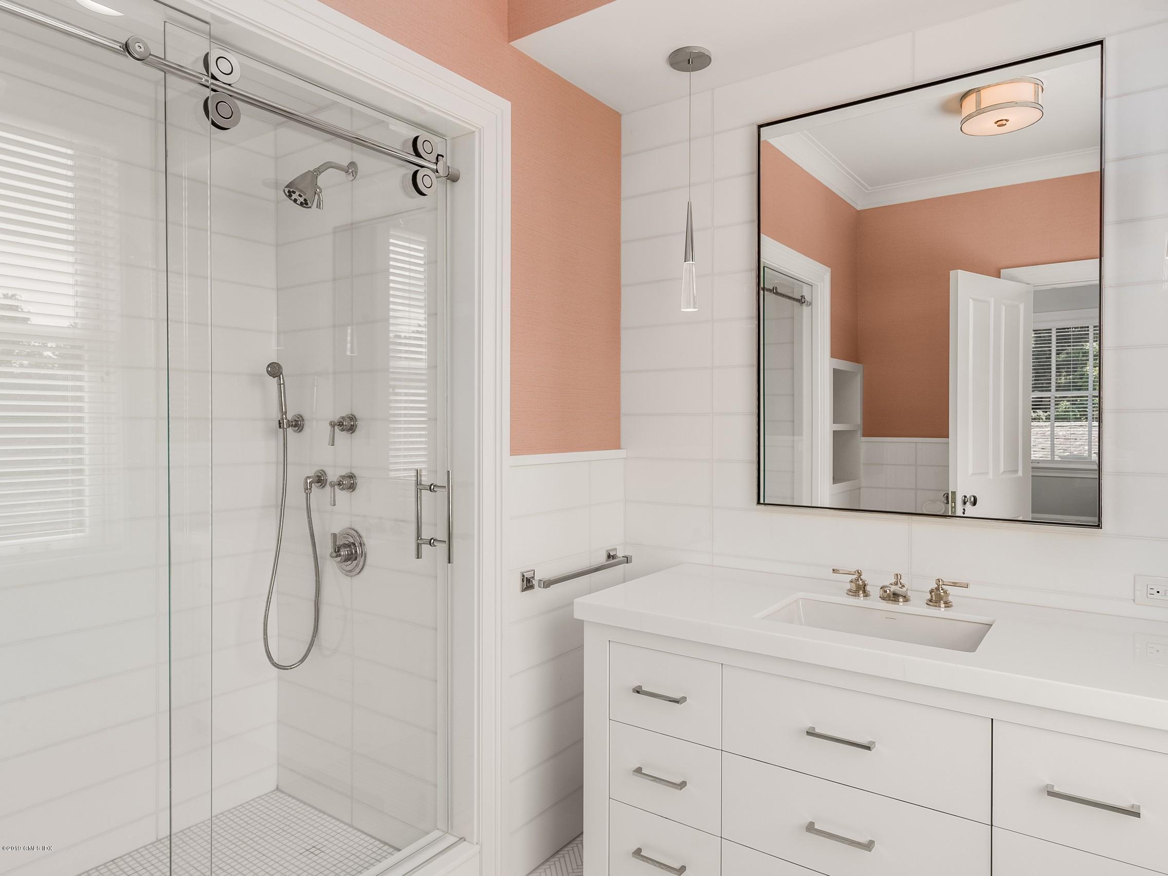 16 Andrews Farm Road Greenwich, CT 06831 - Photo 25 of 44 a bathroom with a granite countertop shower sink and mirror