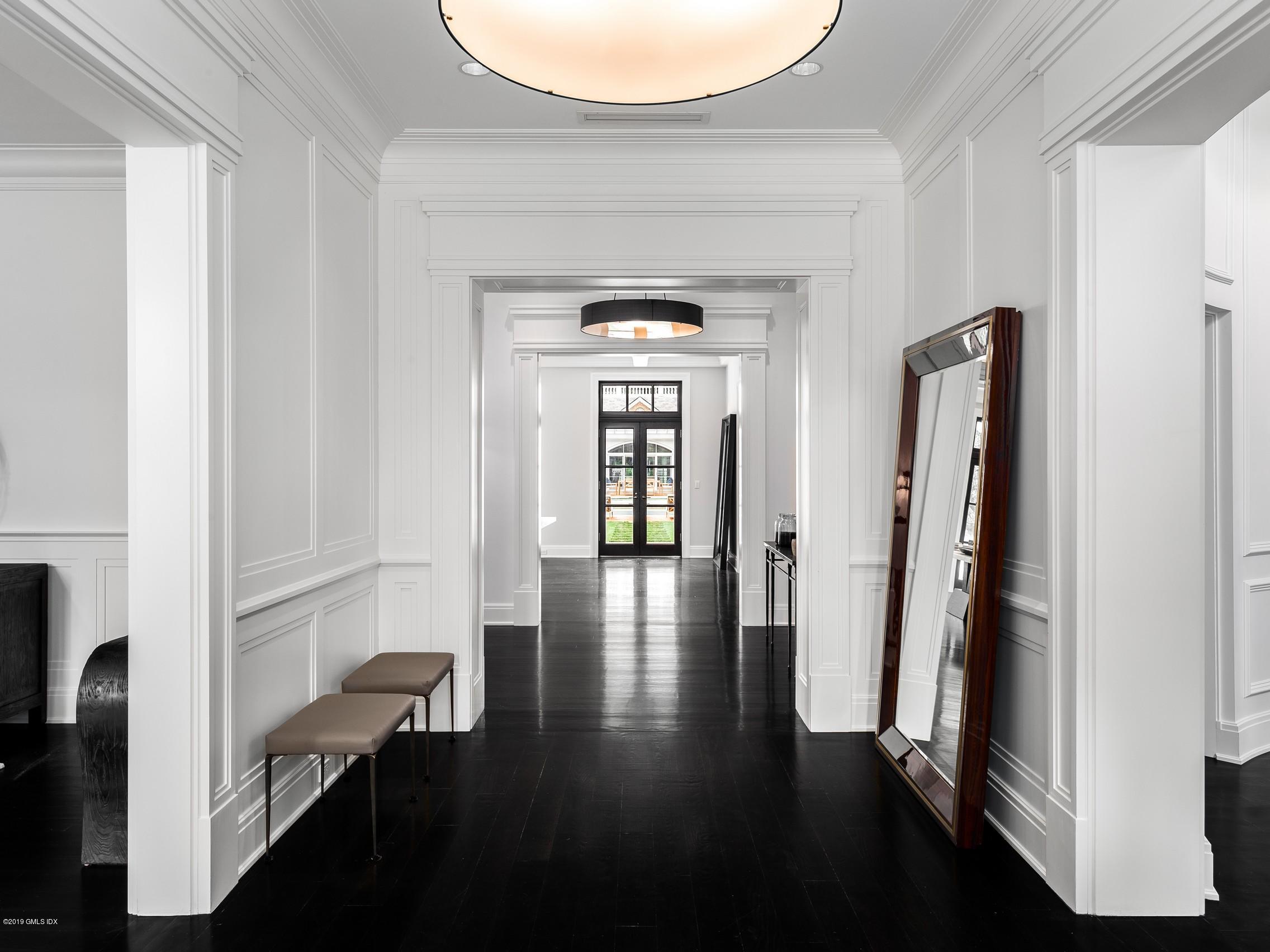 16 Andrews Farm Road Greenwich, CT 06831 - Photo 4 of 44 wooden floor with a view of a hallway