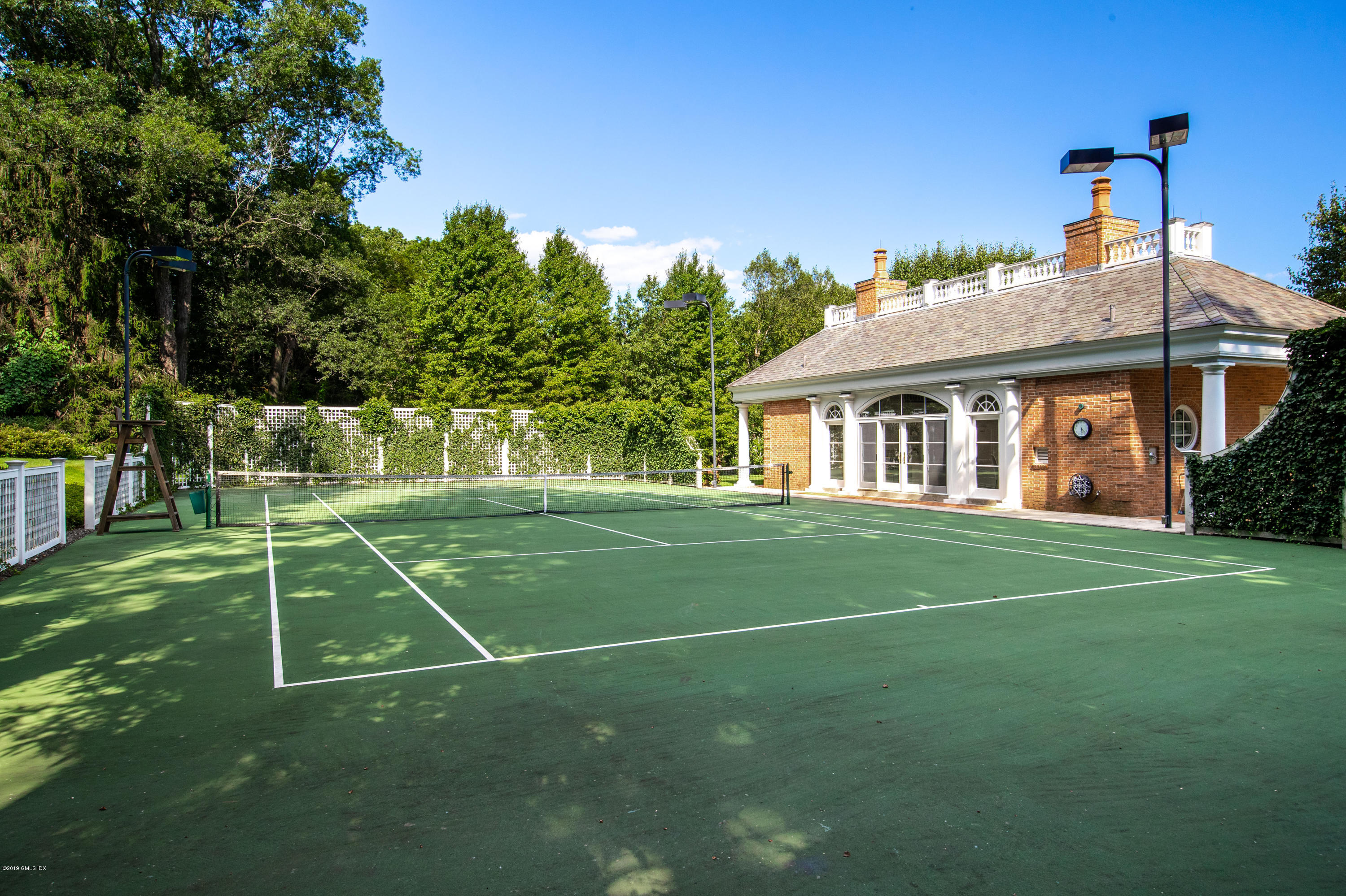 16 Andrews Farm Road Greenwich, CT 06831 - Photo 41 of 44 a view of a house with a big yard