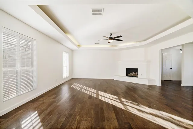 a view of an entryway with wooden floor