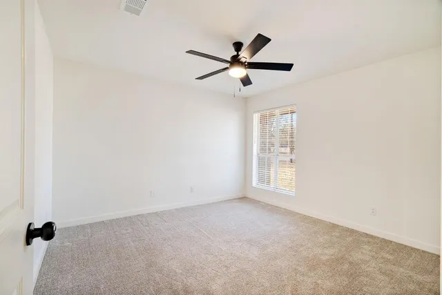 a large white bathroom with a large mirror