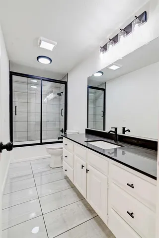 a view of a livingroom with a ceiling fan and window
