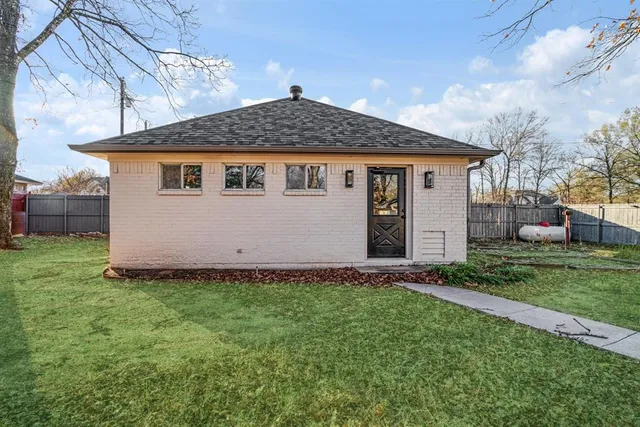 a view of yard with small plants and trees