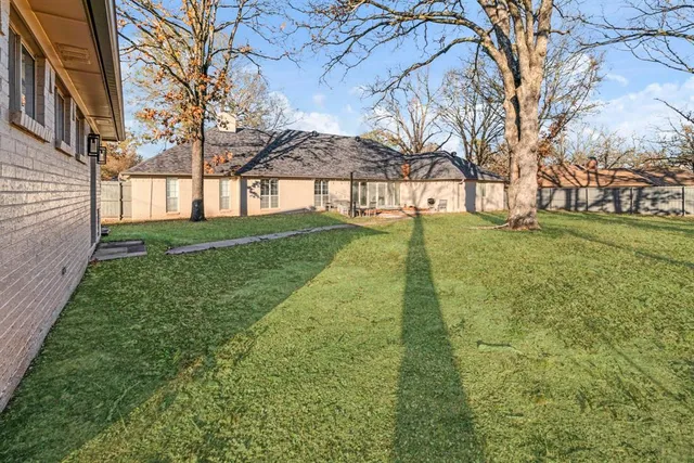 a view of an empty room with a fireplace