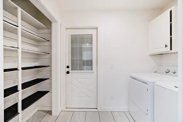 a kitchen with stainless steel appliances granite countertop a sink and cabinets