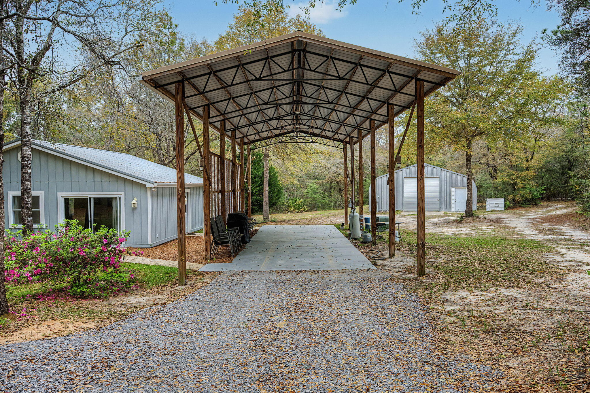 6730 Owens Road Laurel Hill, FL 32567 - Photo 2 of 36 a view of a house with backyard and garden