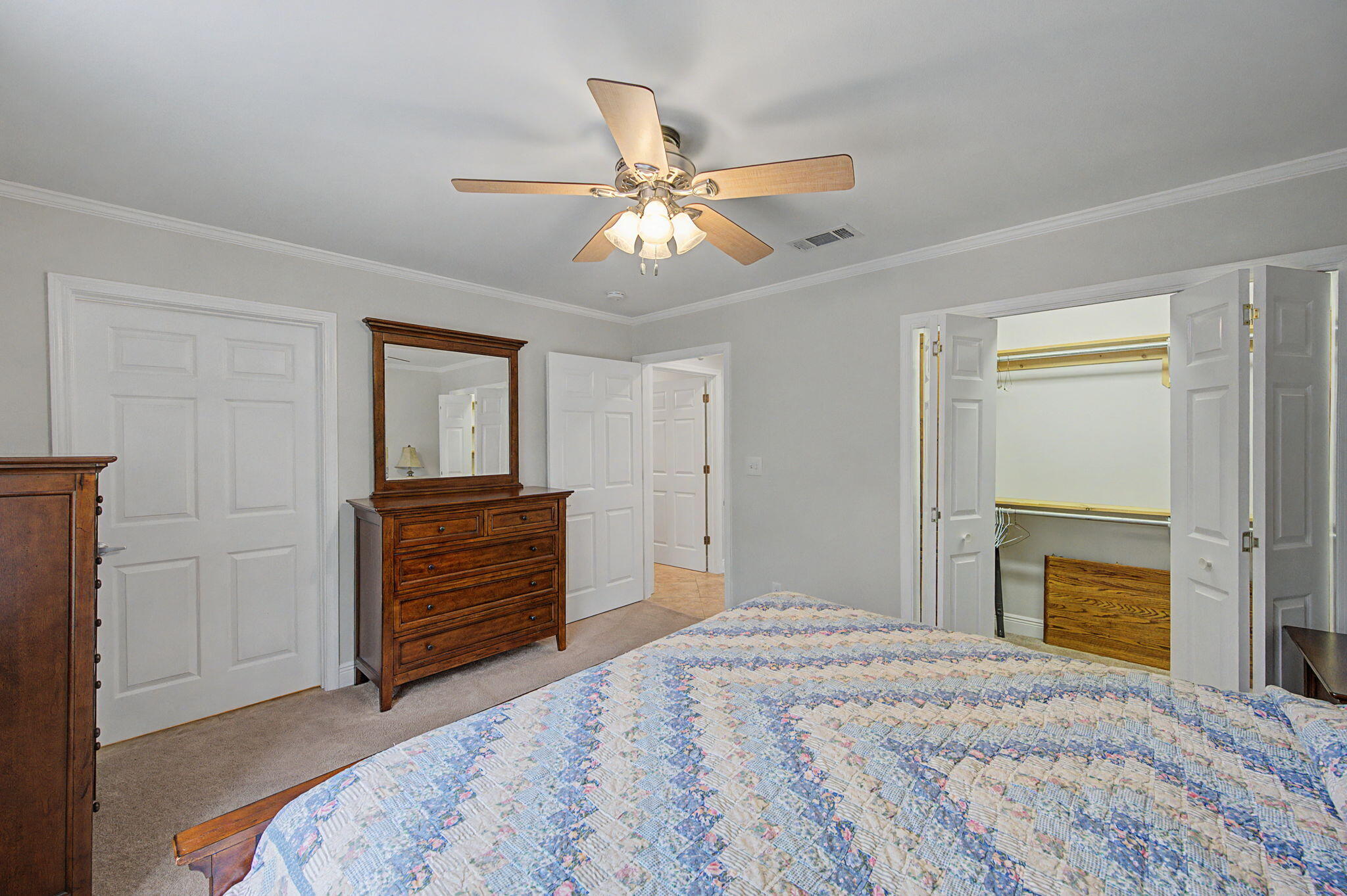 6730 Owens Road Laurel Hill, FL 32567 - Photo 21 of 36 a bedroom with a bed and a dresser