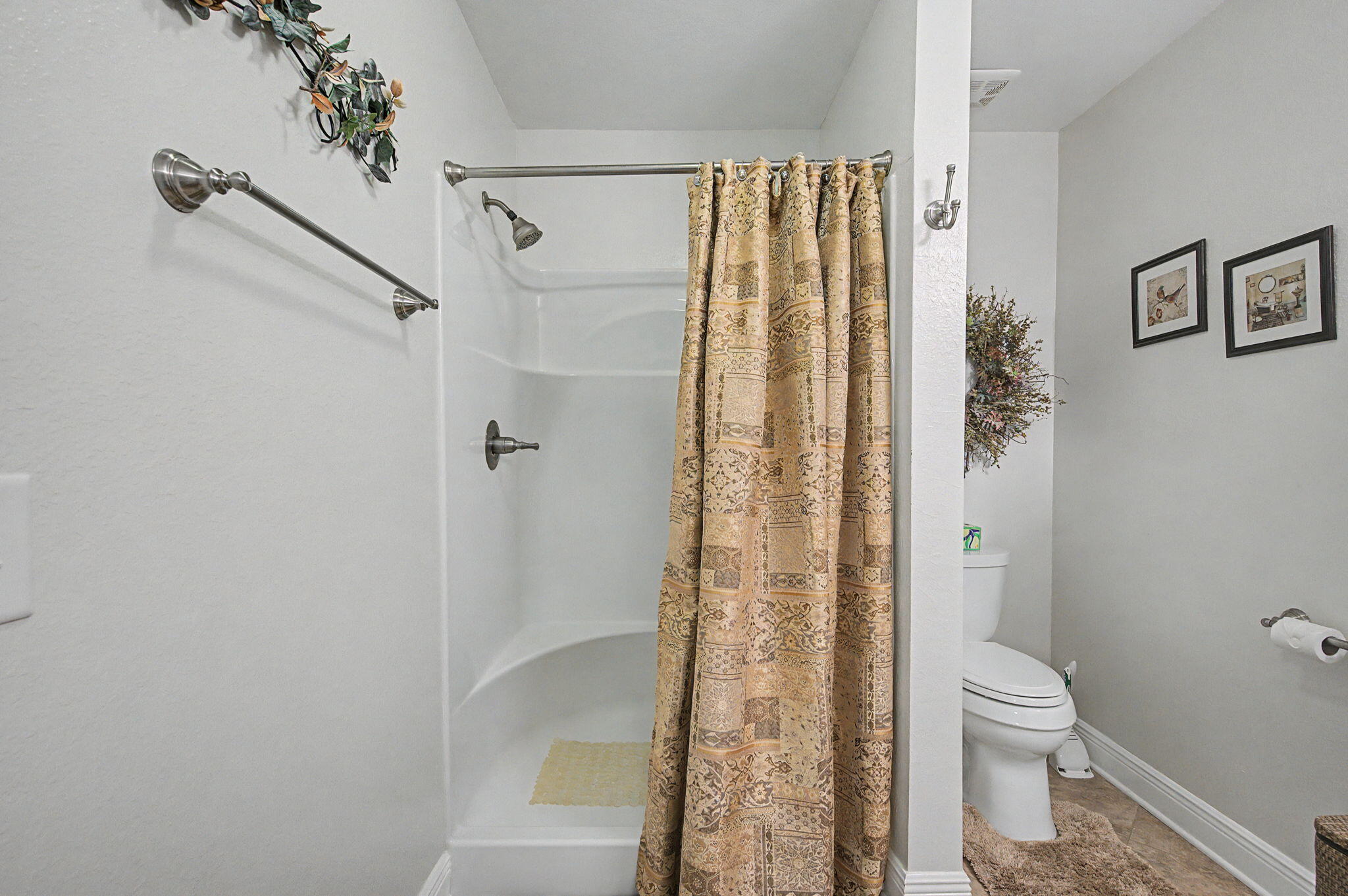 6730 Owens Road Laurel Hill, FL 32567 - Photo 23 of 36 a bathroom with a shower and a toilet