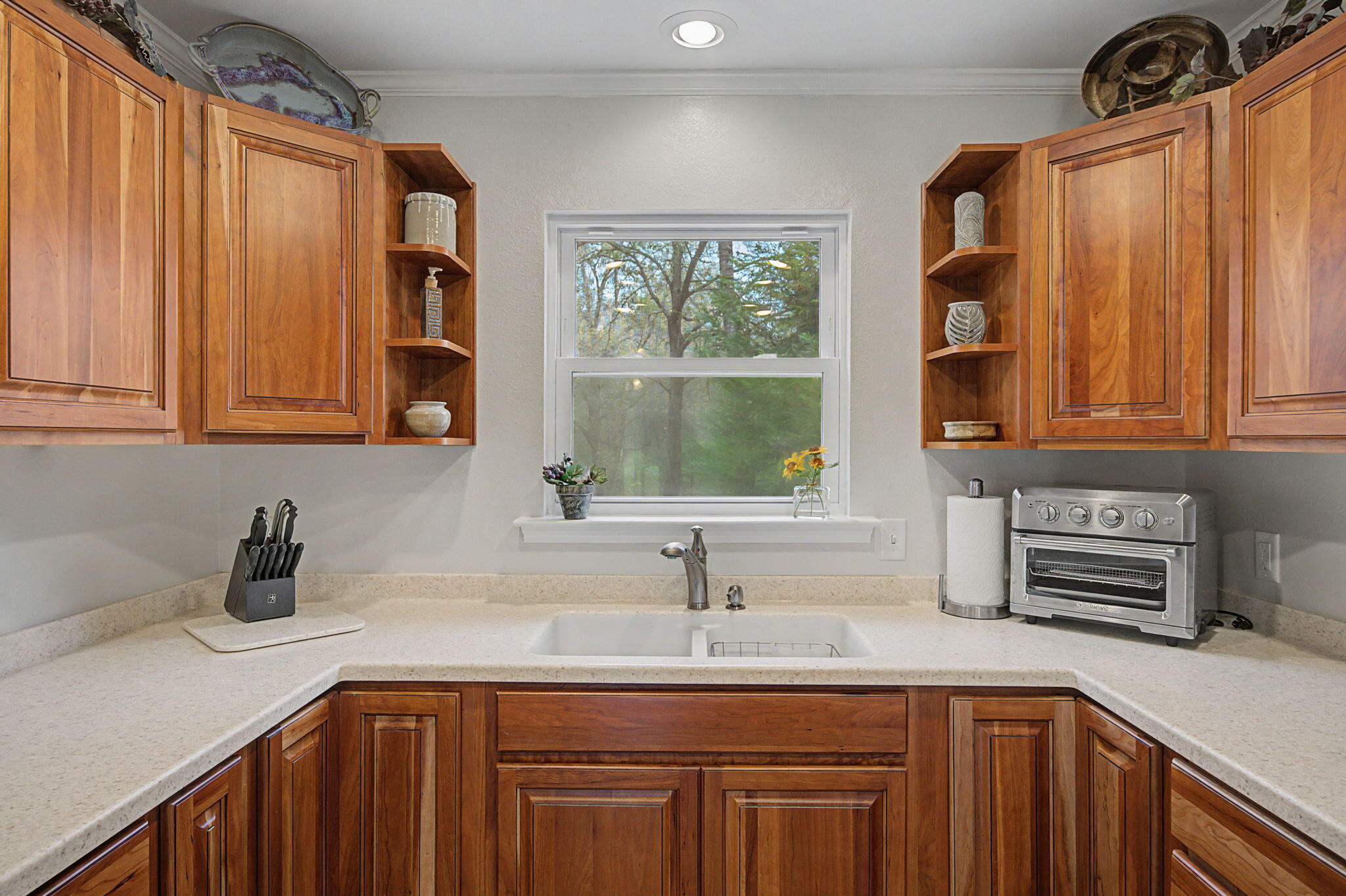 6730 Owens Road Laurel Hill, FL 32567 - Photo 28 of 36 a kitchen with stainless steel appliances granite countertop a sink a window and cabinets