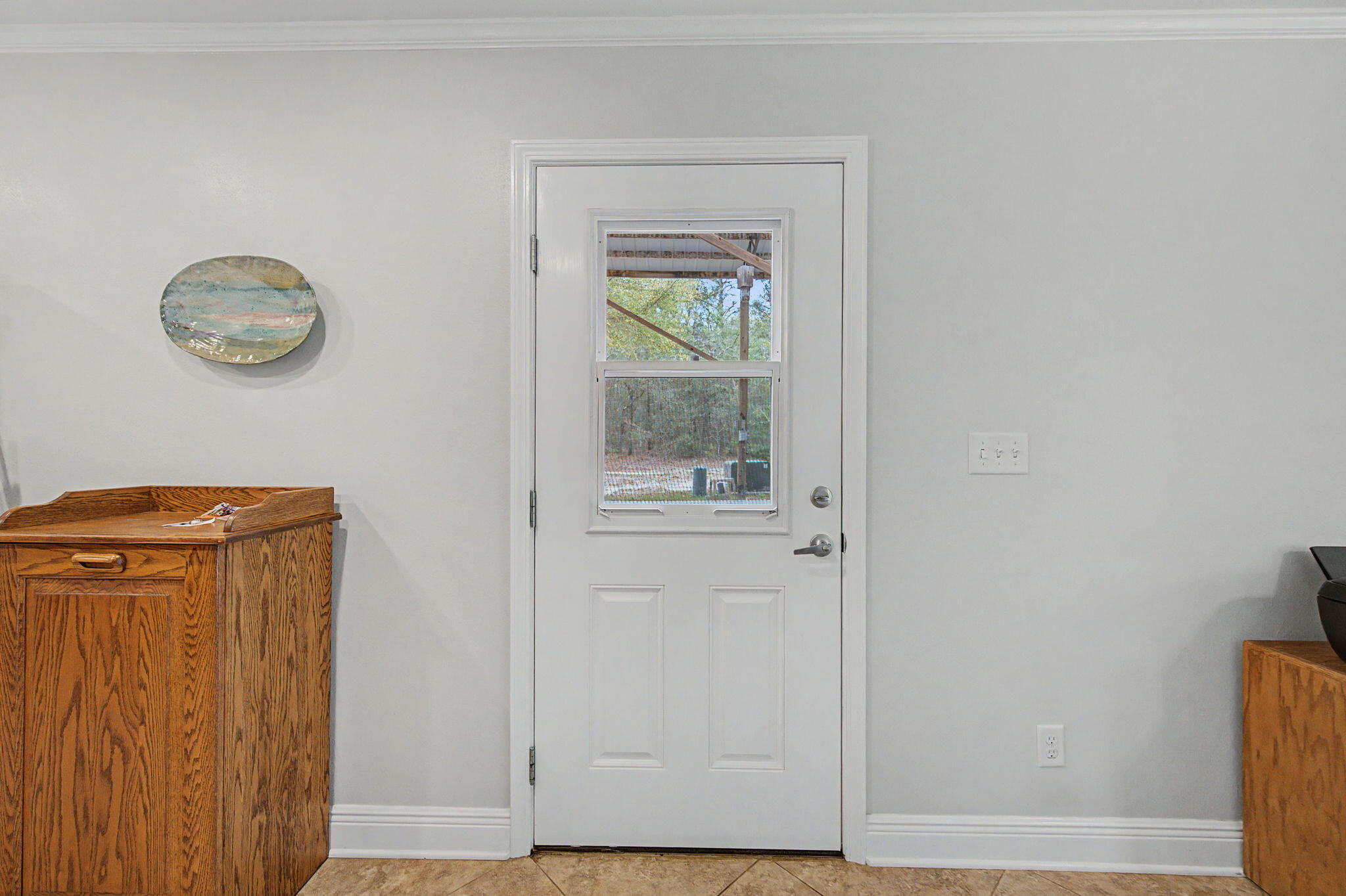 6730 Owens Road Laurel Hill, FL 32567 - Photo 31 of 36 a view of a hallway with wooden floor