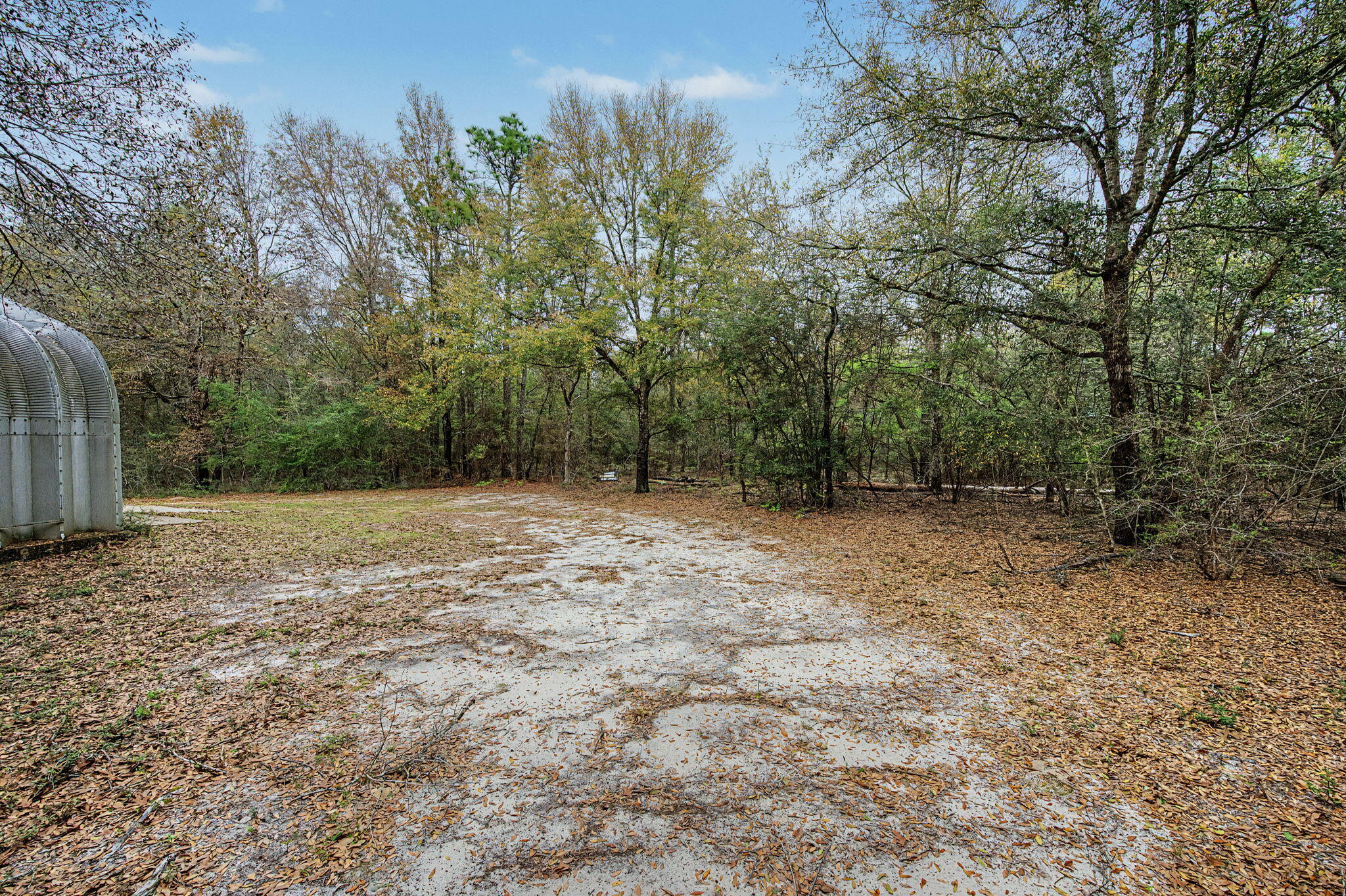 6730 Owens Road Laurel Hill, FL 32567 - Photo 33 of 36 a view of outdoor space with deck and tree