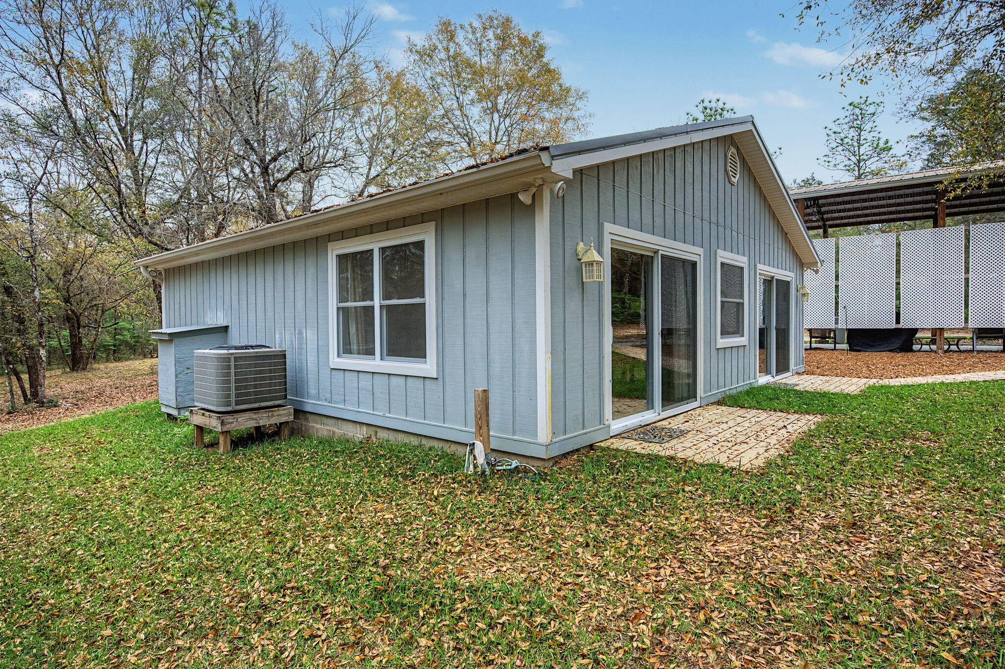 6730 Owens Road Laurel Hill, FL 32567 - Photo 8 of 36 a view of a house with a yard