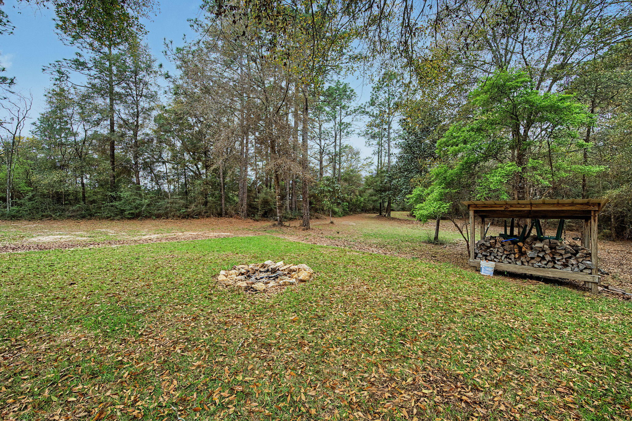 6730 Owens Road Laurel Hill, FL 32567 - Photo 9 of 36 a view of a backyard with a garden