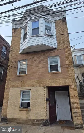 a building view with a brick wall