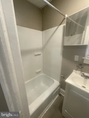 a bathroom with a sink and a shower
