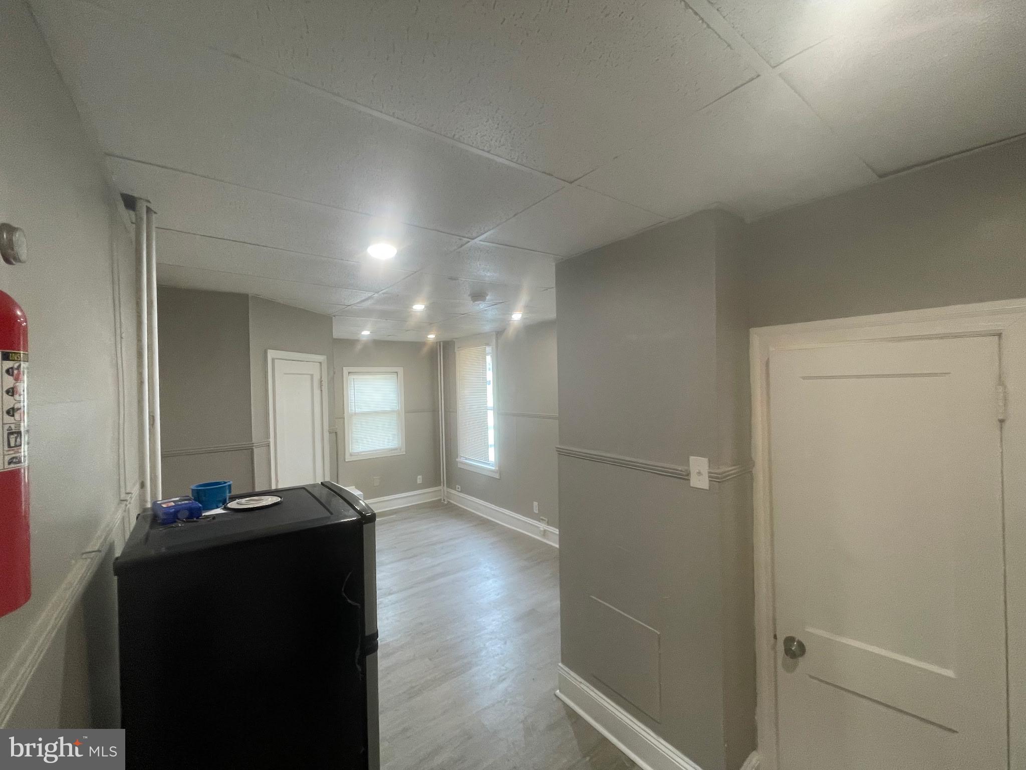 131 MacDade Boulevard, Unit 2F Collingdale, PA 19023 - Photo 10 of 14 a view of a hallway with wooden floor