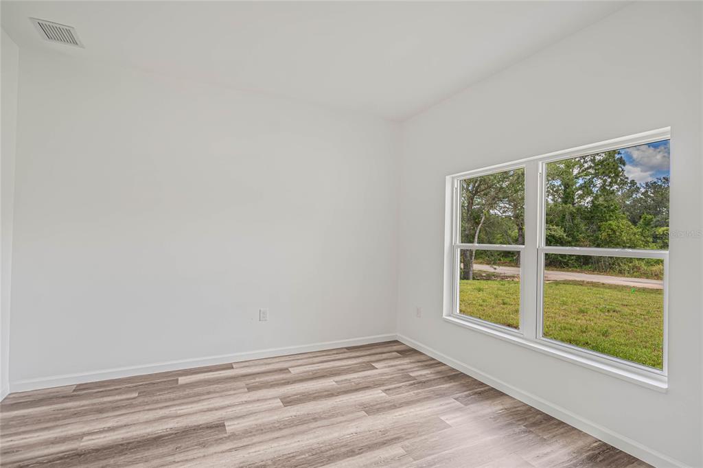8001 Leonardo Street Sebring, FL 33872 - Photo 23 of 32 a view of empty room with window