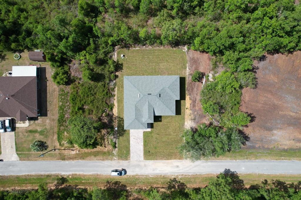 8001 Leonardo Street Sebring, FL 33872 - Photo 28 of 32 an aerial view of a house with yard and lake view