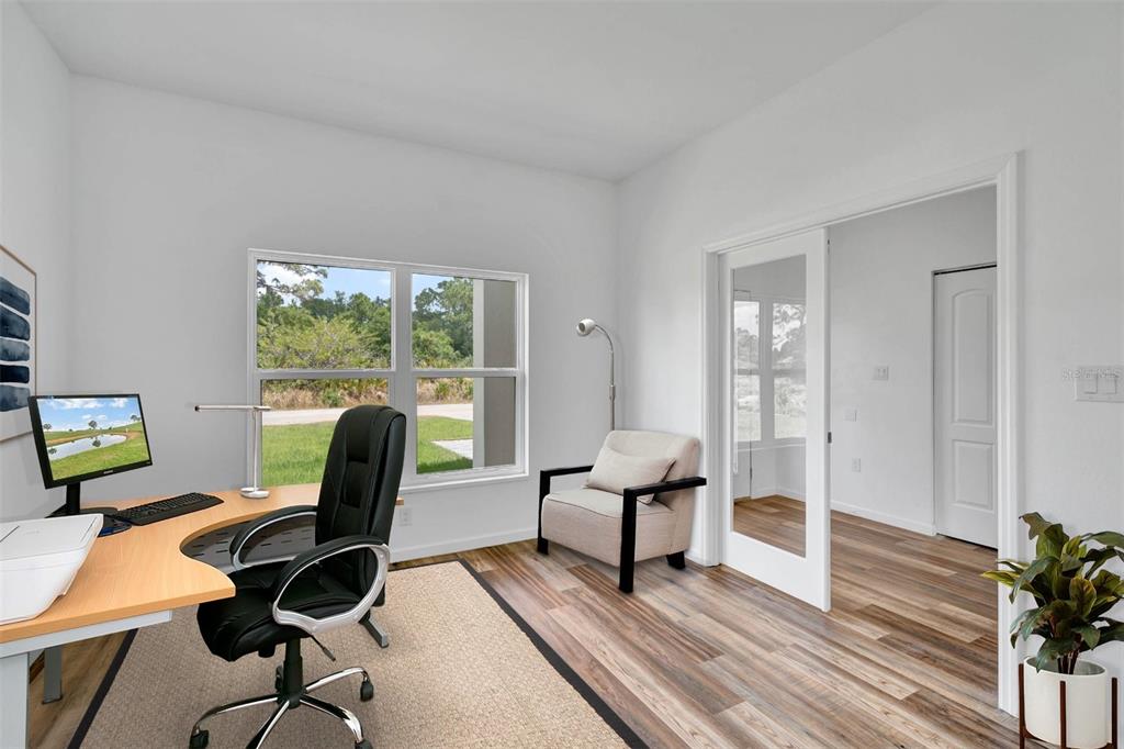 8001 Leonardo Street Sebring, FL 33872 - Photo 3 of 32 a view of a workspace with furniture and a window
