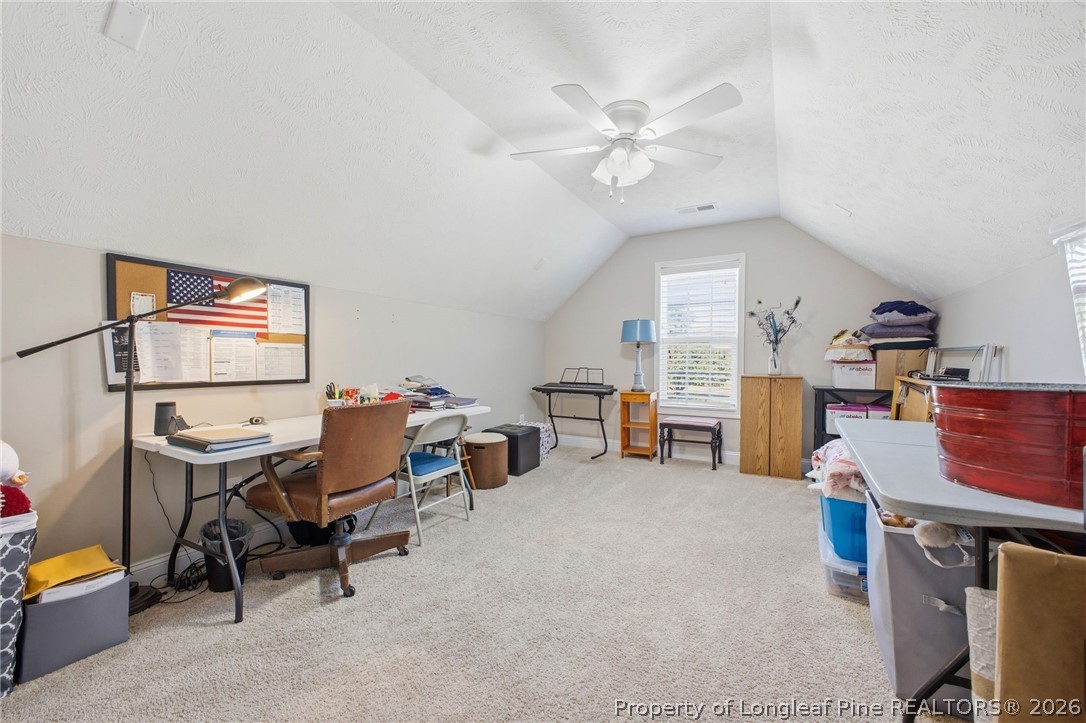 2589 June Johnson Road Raeford, NC 28376 - Photo 22 of 49 a living room with furniture and a chandelier