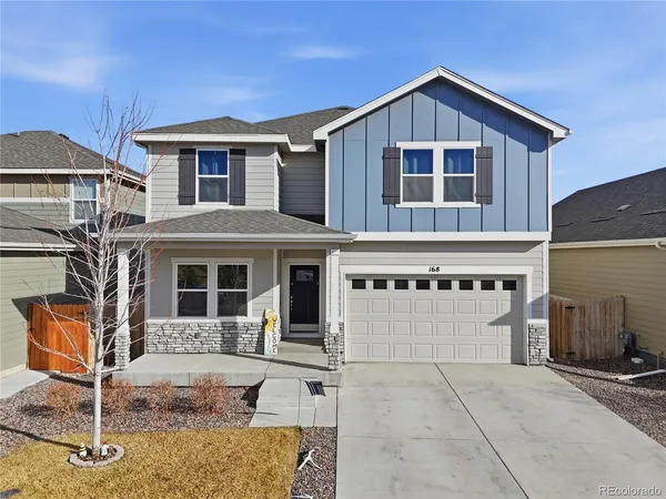 a front view of a house with garage