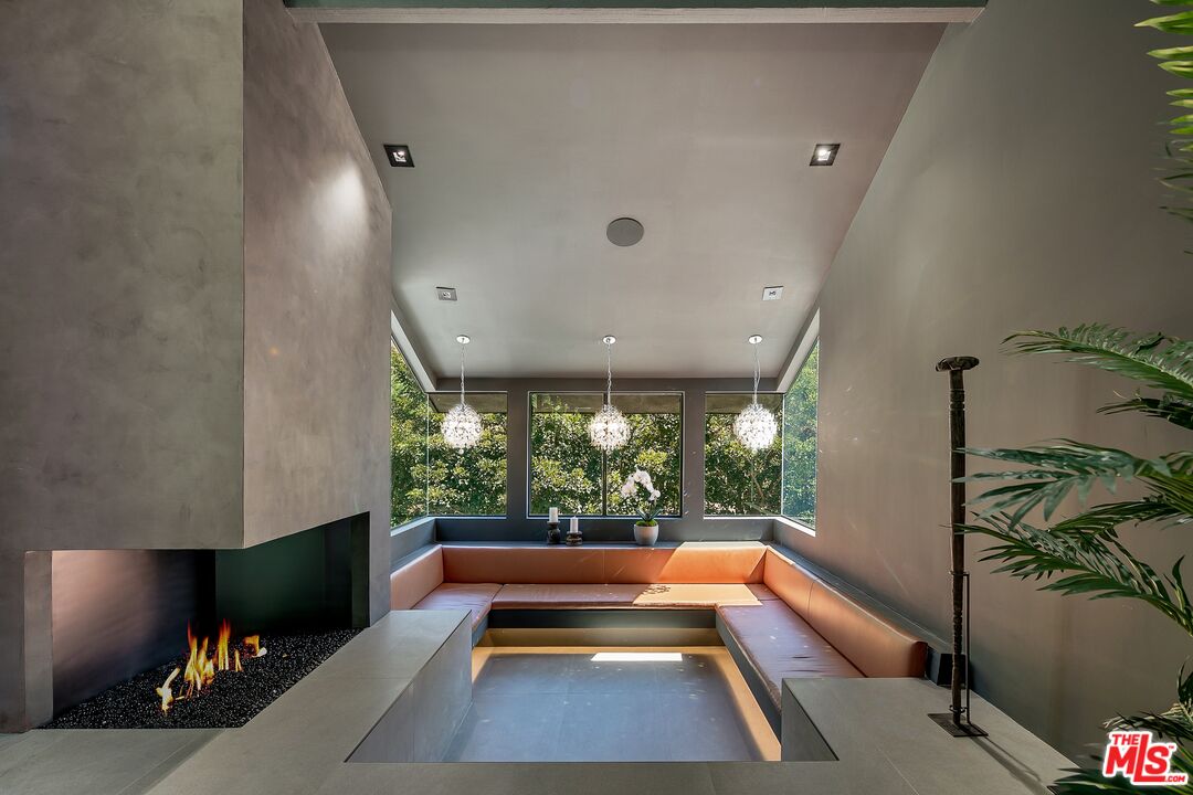 2001 Roscomare Road Los Angeles, CA 90077 - Photo 13 of 62 a view of a lobby area with furniture and a potted plant
