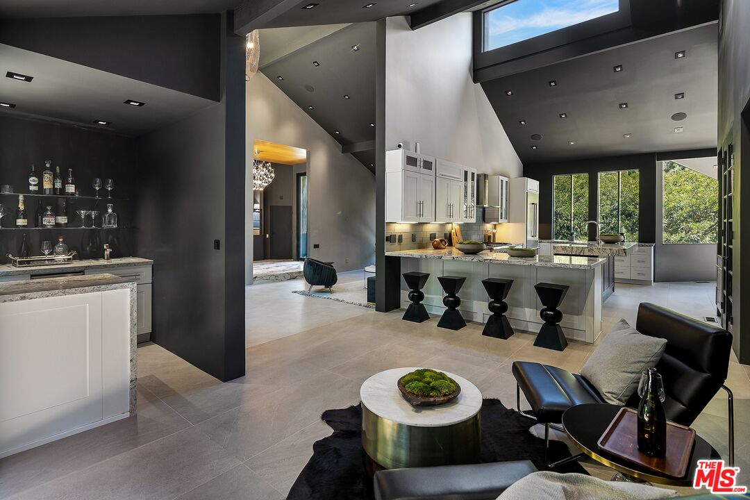2001 Roscomare Road Los Angeles, CA 90077 - Photo 16 of 62 a kitchen with a table and chairs in it