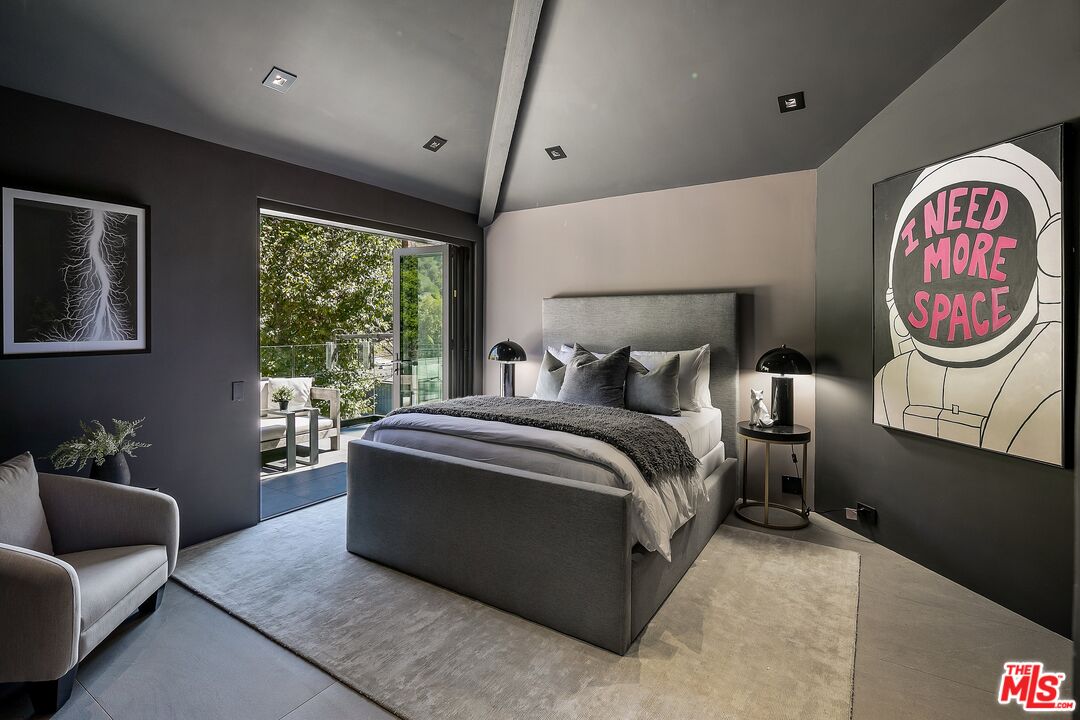 2001 Roscomare Road Los Angeles, CA 90077 - Photo 23 of 62 a bedroom with a bed and a couch