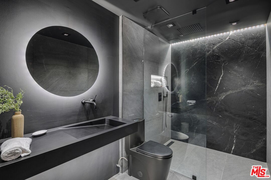 2001 Roscomare Road Los Angeles, CA 90077 - Photo 24 of 62 a bathroom with a toilet and a sink