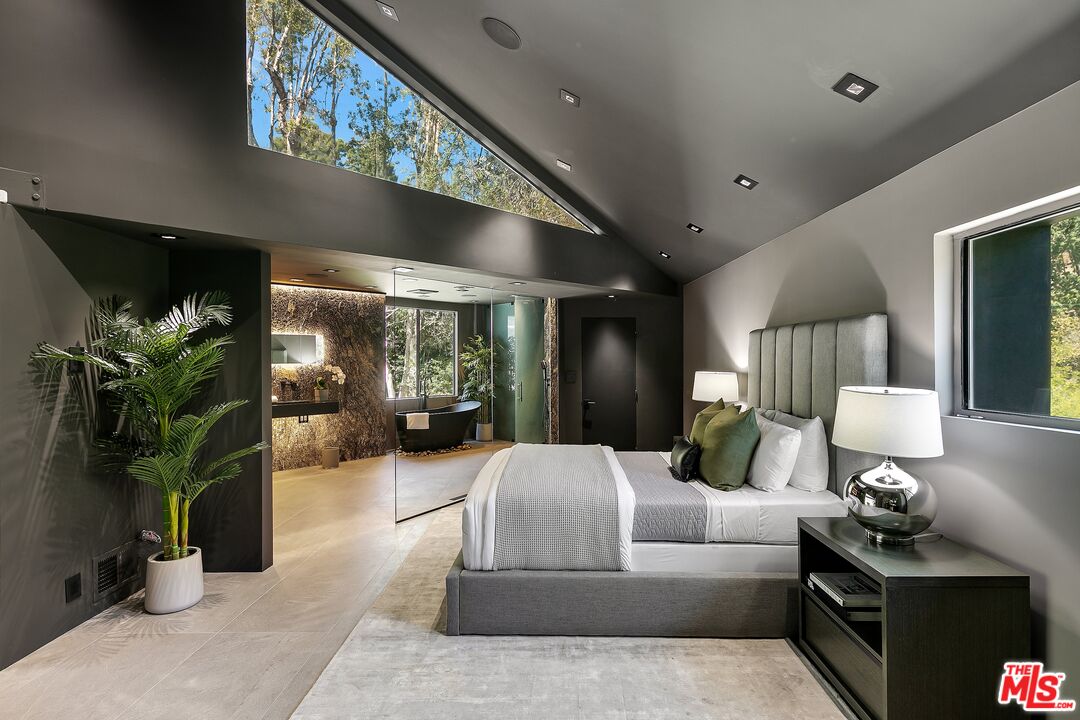 2001 Roscomare Road Los Angeles, CA 90077 - Photo 28 of 62 a living room with furniture flowerpot and a potted plant