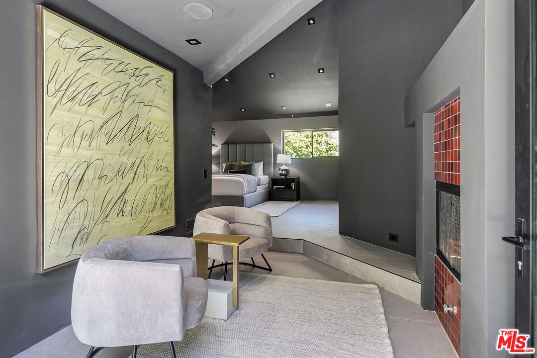 2001 Roscomare Road Los Angeles, CA 90077 - Photo 30 of 62 a living room with furniture and a large window