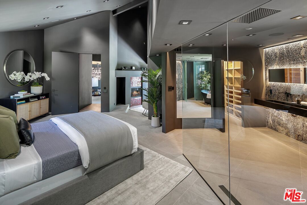 2001 Roscomare Road Los Angeles, CA 90077 - Photo 31 of 62 a large bedroom with a large bed and furniture