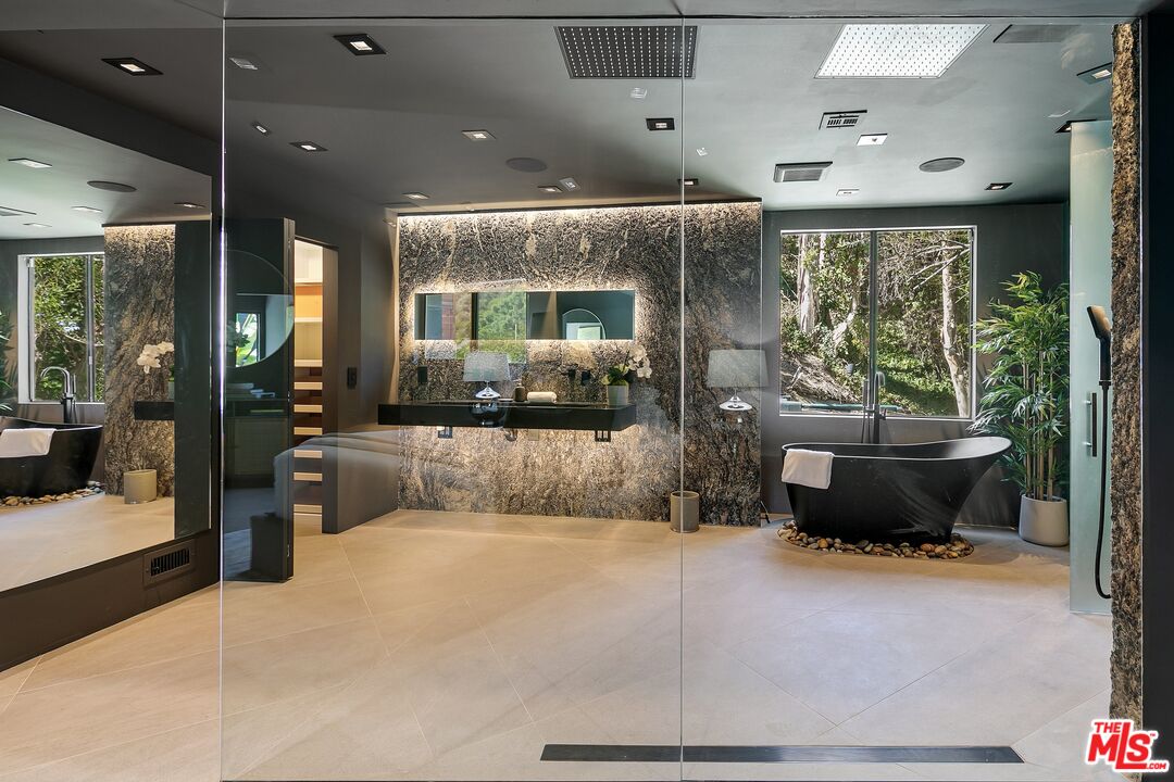 2001 Roscomare Road Los Angeles, CA 90077 - Photo 32 of 62 a living room with furniture and a large window