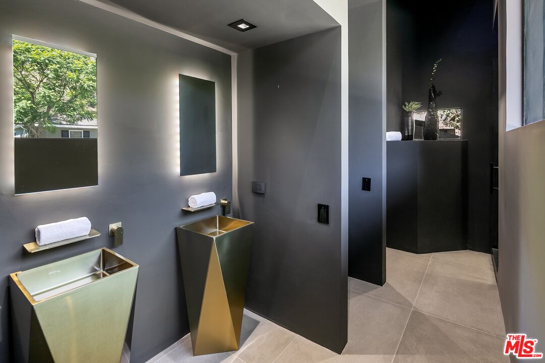 2001 Roscomare Road Los Angeles, CA 90077 - Photo 36 of 62 a bathroom with a sink toilet and shower