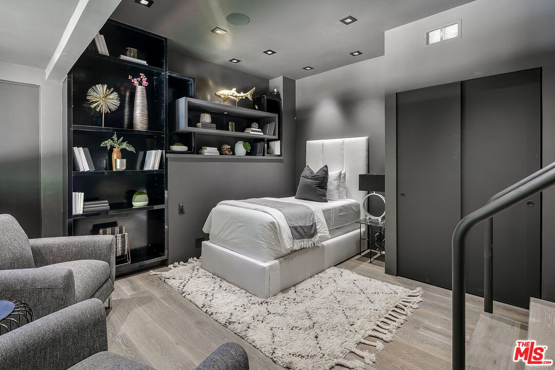 2001 Roscomare Road Los Angeles, CA 90077 - Photo 38 of 62 a bedroom with a bed window and a couch