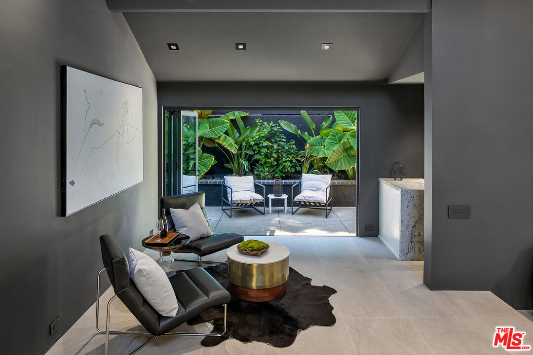 2001 Roscomare Road Los Angeles, CA 90077 - Photo 53 of 62 a living room with furniture and a large window