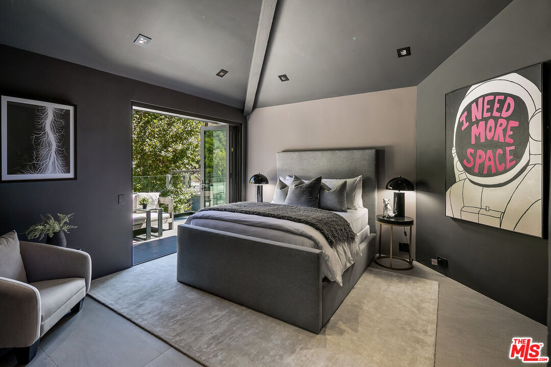 2001 Roscomare Road Los Angeles, CA 90077 - Photo 55 of 62 a bedroom with a bed and a couch