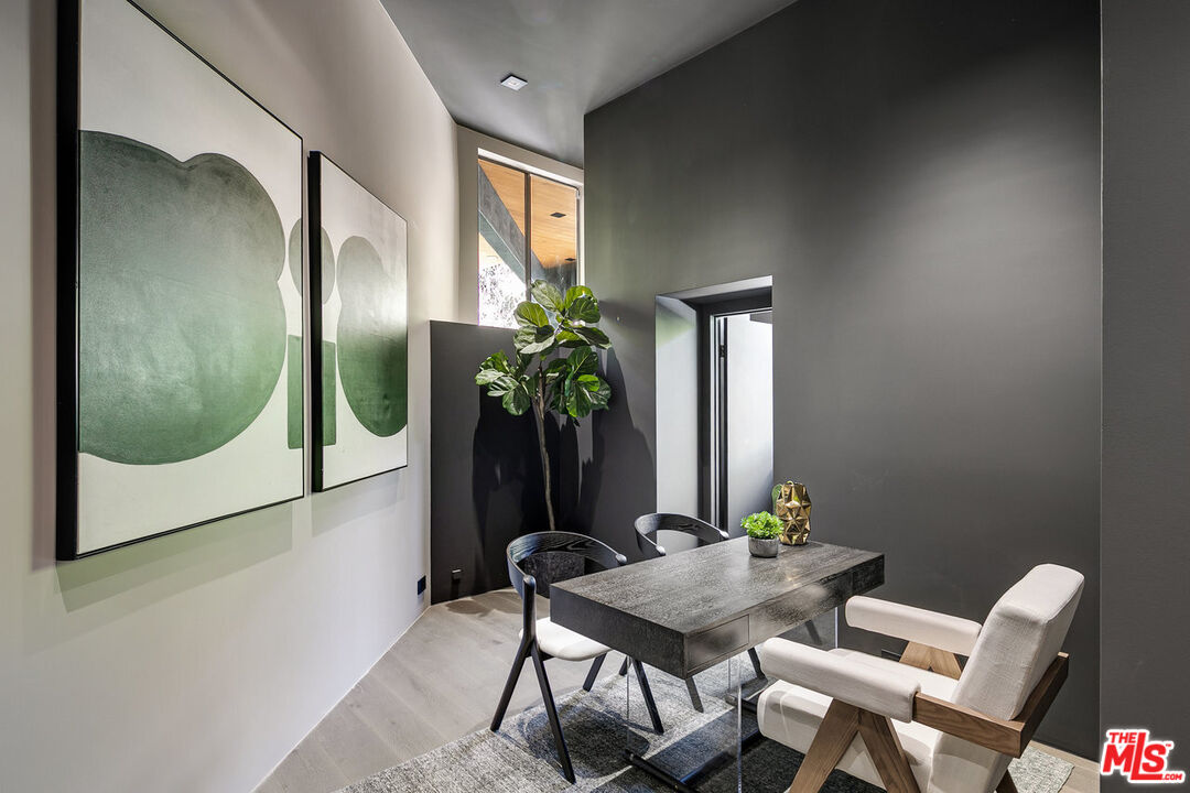 2001 Roscomare Road Los Angeles, CA 90077 - Photo 57 of 62 a view of a hallway with furniture and a potted plant
