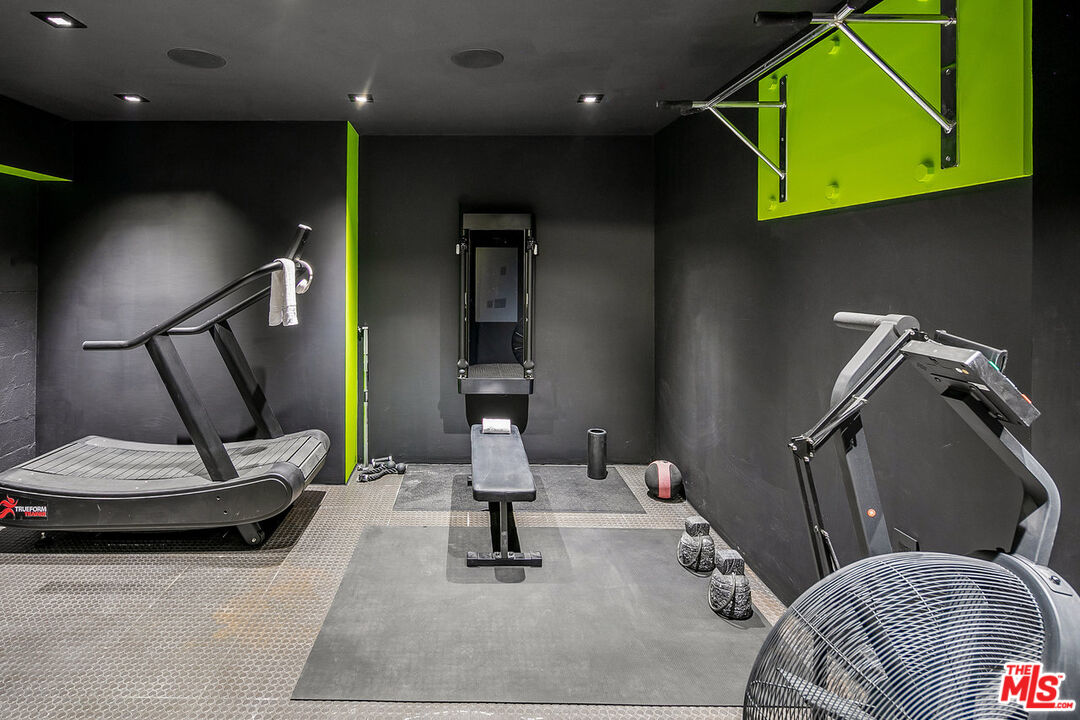 2001 Roscomare Road Los Angeles, CA 90077 - Photo 58 of 62 a living room with furniture and a wooden floor