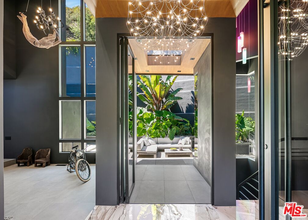 2001 Roscomare Road Los Angeles, CA 90077 - Photo 8 of 62 a view of entryway with wooden floor