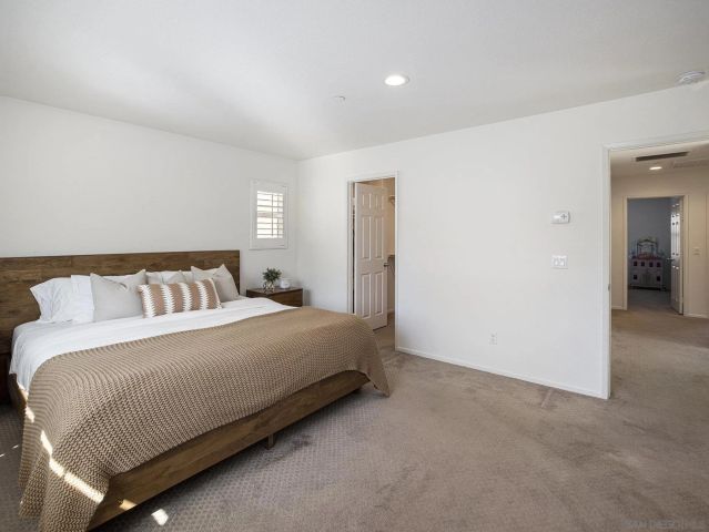 a spacious bathroom with a shower sink and mirror