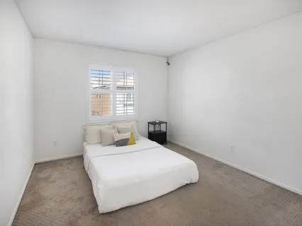 a view of a hallway with closet and cabinet
