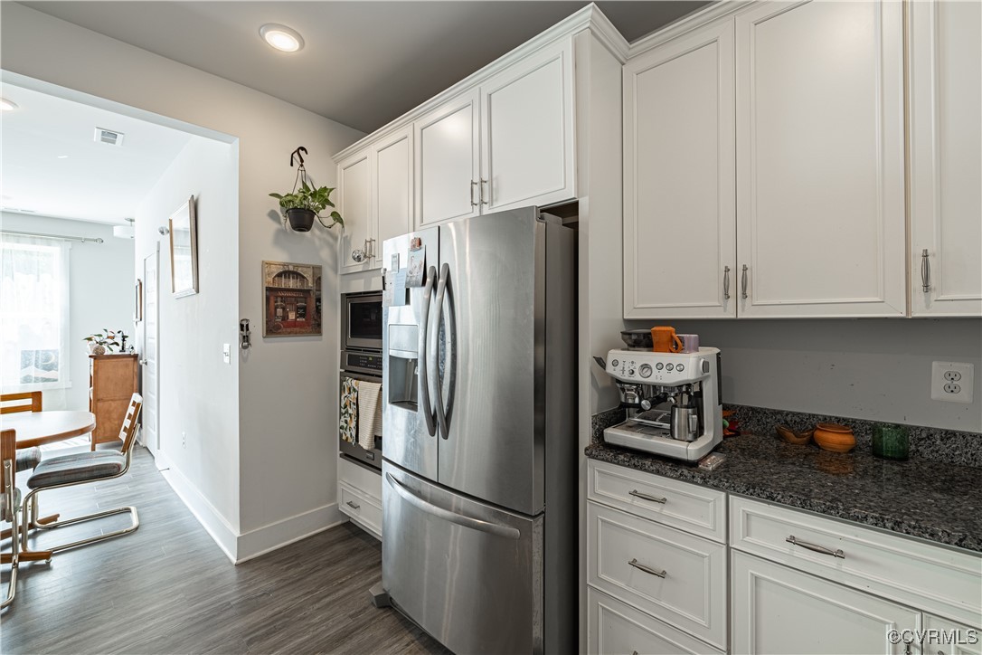 5329 Old Main Street, Unit A Henrico, VA 23231 - Photo 12 of 39 a kitchen with stainless steel appliances granite countertop a refrigerator and a stove top oven