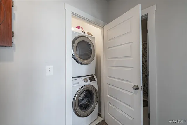 a bedroom with a bed and a desk