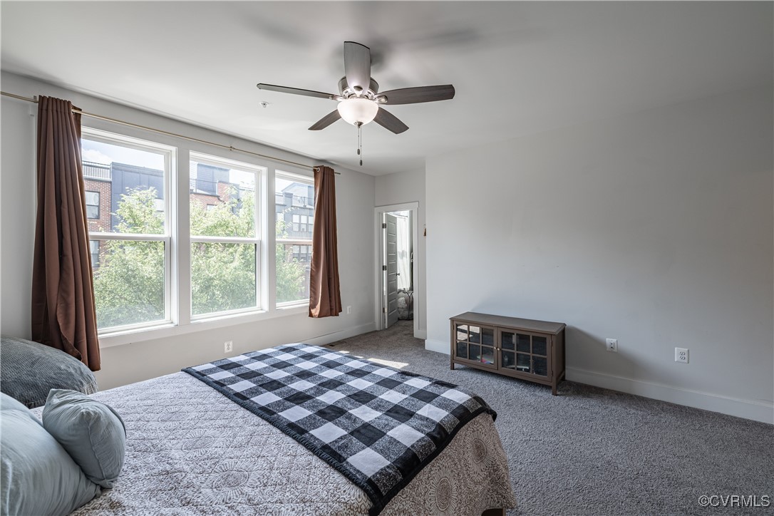5329 Old Main Street, Unit A Henrico, VA 23231 - Photo 28 of 39 a bedroom with a bed and a chandelier