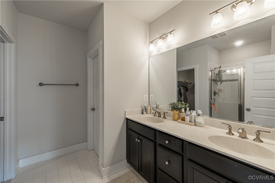 5329 Old Main Street, Unit A Henrico, VA 23231 - Photo 30 of 39 a bathroom with double vanity sinks and a mirror