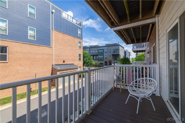 a view of a balcony with furniture