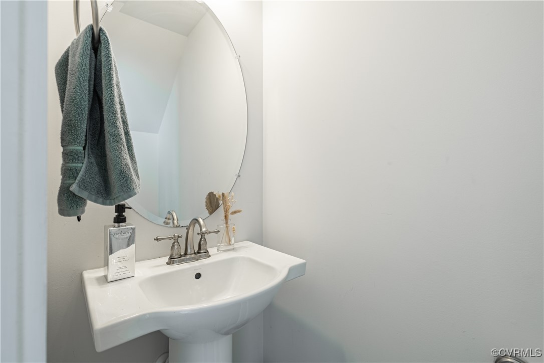 5329 Old Main Street, Unit A Henrico, VA 23231 - Photo 33 of 39 a bathroom with a sink and a mirror